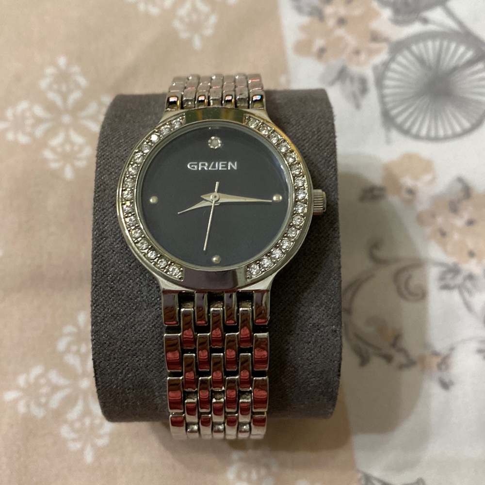 Ladies silver watch with rhinestones.